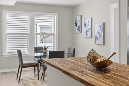 Eat-in kitchen with butcher block island and breakfast nook at 9205 S Utica Ave
