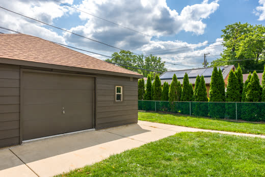 Detached garage with new siding and brand-new roof at 9205 S Utica Ave, Evergreen Park IL