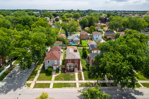 Aerial front view of brick two-story home at 9205 S Utica Ave, Evergreen Park IL